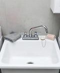 Lead-Free 4 Inch Deck Mount Commercial Kitchen Sink Faucet 8" Swivel Spout above a white sink with towels nearby.