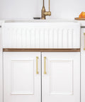30 Pack 5 1/16 Inch Gold Cabinet Handles on white kitchen cabinets, solid zinc alloy heavy duty pulls, brushed gold finish.