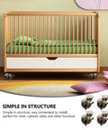 Four Pack Premium Vintage Brass Furniture Casters Featuring Badass Smooth Rolling Universal Swivel Wheels mounted on a crib.
