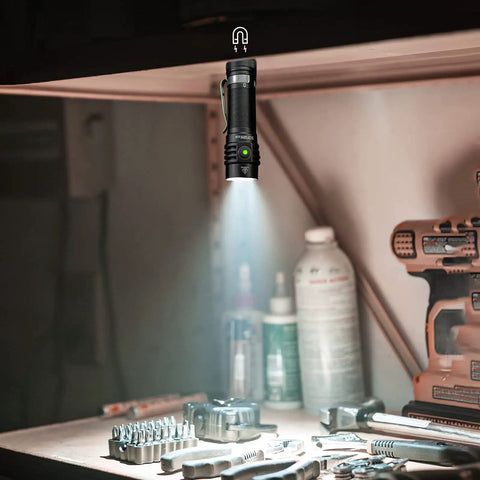 Compact EDC Rechargeable Flashlight With 1800 Lumen Output, SST 40 LED, Magnetic Tail Cap in workshop setting.