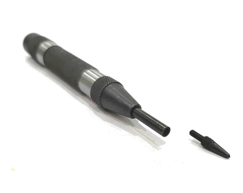 Heavy Duty Automatic Center Punch With Replaceable Hardened Steel Tip Spring Loaded Precision Marking Tool resting with tip beside it