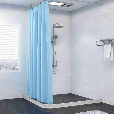 Image of a bathroom with a blue shower curtain and 39 Inch Collapsible Shower Dam Barrier Keeps Water In The Shower And Floors Dry.