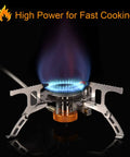 Portable Camping Gas Stove With 1Lb Propane Tank Adapter lit with blue flame, showing foldable design and piezo ignition for outdoor use.