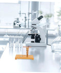 Easy To Use Pendulum Inertia Demonstrator For Physics Labs kit on lab table with test tubes and microscope