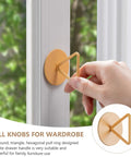 Hand installing Adhesive Stick On Cabinet Handles 3 Pack Triangle And Hexagon Pull Knobs No Drill Easy Install On Window