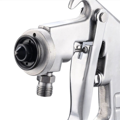Professional 1000ml Pneumatic Spray Gun With Big Iron Hopper And Precision 1.8mm Tip close-up of nozzle and air connection for precise painting.