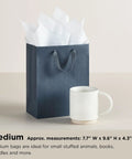 9-Inch Medium Gift Bag With Tissue Paper In Pink Glitter Stripes For Valentines Day Birthdays Baby Showers Bridal Showers Or Any Occasion Durable Gift Bag With Card Holder And Up To Five-Pound Capacity shown with white tissue paper and coffee mug scale
