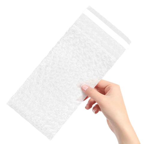 Hand holding a transparent bubble pouch, Self Adhesive Bubble Cushioning Pouches Made From PE Material 100 Pack Pro Grade Reusable Protective Bags