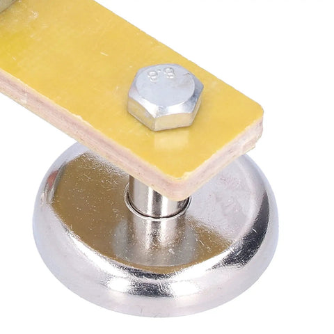 Heavy Duty Welding Ground Clamp Tools With Magnetic Base And Dual Strong Magnets For Secure Mechanical Maintenance Holds Firmly At Up To 300 Amps Current Without Slippage During Tough Fabrication Projects close-up of magnet base with yellow insulation.
