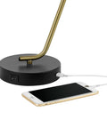 Industrial Luxe 17 Inch Desk Lamp In Matte Black With Antique Brass Accents base and USB port charging phone