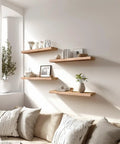 Set Of Six Premium Solid Wood Floating Wall Shelves Light Brown Oak Style Real Timber Grain Decor For Bedroom Living Room Knockout Design Hella Durable Modern Rustic Look 17 Inch Width Easy Mount Home Storage Solution on white wall with decor.