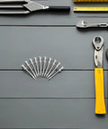 Lawn Aerator Shoes Spikes Kit with Durable Metal Nails for Lawn Aeration, 20 Piece Set arranged with tools on a grey surface.