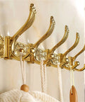 Sleek European Style Golden Coat Hook For Bathroom And Entryway Built Tough Wall Hanging Clothes Rail With Smooth Carved Details Premium Wall Mount with five hooks.