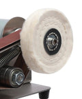 Close-up of the buffing wheel on the No Hassle Workhorse Mini Belt Sander And Knife Sharpener for polishing projects.