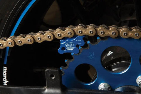 Black Sprocket Jammer Tool For Motorcycle And Bike Maintenance beefy durable heavy duty sprocket locking device in use