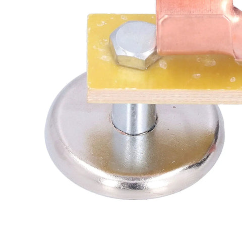 Close-up of Heavy Duty Magnetic Welding Support With Strong Copper Tail Clamp Grounding Tool for Mechanical Repair and Metal Fixtures.
