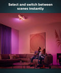 Couple relaxing with Smart Wireless Dimmer Switch V2 For Hue Lights No Bridge Needed Setup Is A Breeze Battery Powered