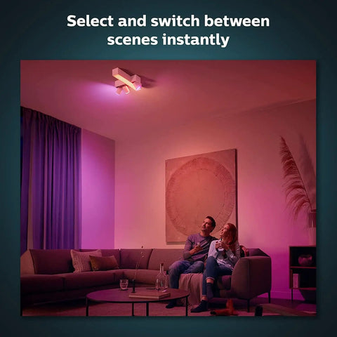 Couple relaxing with Smart Wireless Dimmer Switch V2 For Hue Lights No Bridge Needed Setup Is A Breeze Battery Powered