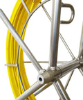 Close-up of fiberglass fish tape reel for duct rodder 6mm by 350ft with brake system, featuring sturdy metal frame and guide ring.
