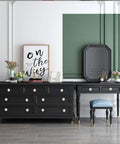 Elegant room with black dresser and vanity, decorated with vintage style, featuring drawers with White Ceramic Cracked Cabinet Handles Set of 10.