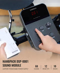 Person adjusting sound module for Electric Drum Set For Beginners And Kids That Slaps With 7 Inch Quiet Mesh Pads