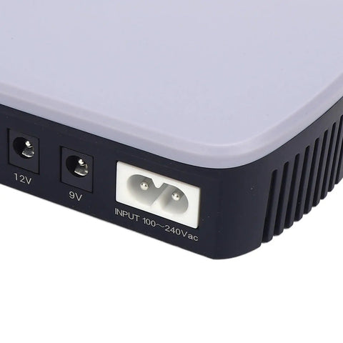 Heavy Duty 10400mAh UPS Battery Backup For Router Modem And Security Cameras input ports detail with 12V and 9V connections.