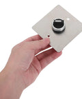 Built Like A Tank Stainless Steel Three Position Selector Switch Panel for Heavy Duty Industrial Machinery Control held in hand.