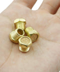Four Piece Sintered Bronze Breather Vent Kit One Eighth Inch NPT For Single Acting Cylinders Or Valves in hand view.