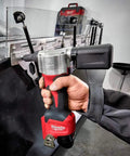 Hand using M12 Cordless Rivet Tool Kit for No Fuss Riveting on Aluminum, Steel And Stainless Rivets, 0.8 Inch Stroke, Lightweight