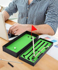 Awesome Golf Pen Set With Mini Desktop Putting Green And Ball Pens on office desk beside laptop