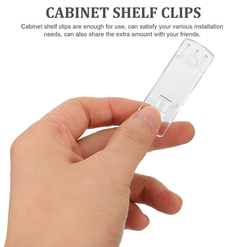 Hand holding a transparent Locking Plastic Shelf Pegs For Cabinets And Furniture, Rectangular Clips, Handy 25 Piece Set.