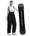 Woman wearing Womens Baggy Ski Bibs And Snowboard Pants Waterproof Windproof Insulated Overalls For Warmth Comfort And Dry Rides