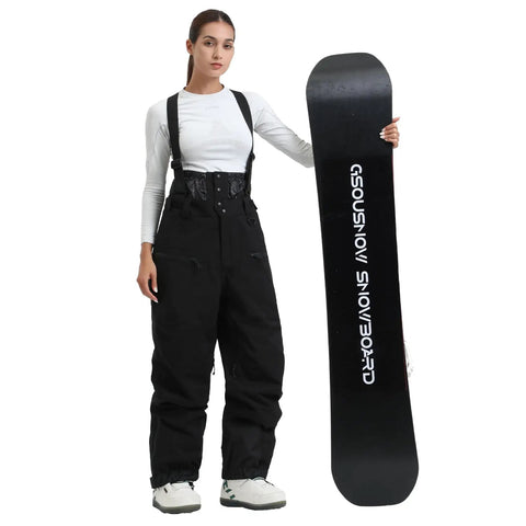 Woman wearing Womens Baggy Ski Bibs And Snowboard Pants Waterproof Windproof Insulated Overalls For Warmth Comfort And Dry Rides