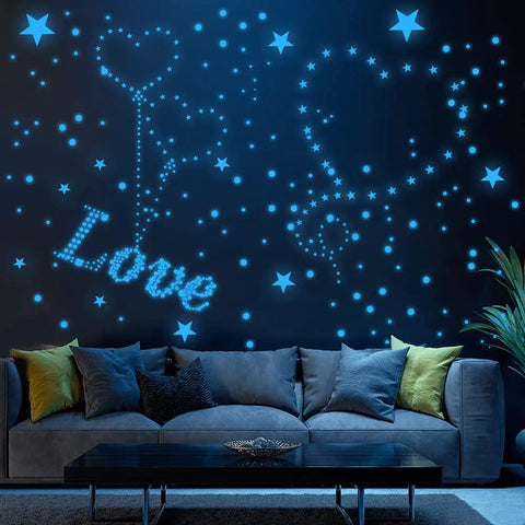 Glow In The Dark Star And Moon Stickers Kit With 1120 Pieces For Ceiling Decor in a living room setting with glowing star patterns