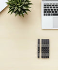 No Sweat Screwless 3.5 Inch Hard Drive Caddy Rails Five Pairs laid out on a desk with a laptop and plant.