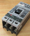 Heavy Duty Hfxd63B150 150 Amp 3 Pole 600 Volt Molded Case Circuit Breaker on a wooden surface, showcasing durable design.