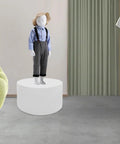 Heavy Duty 220 LB Capacity 20 Inch Round Mannequin Display Pedestal Stand In White For Retail Store Visual Merchandising And Shop Window Presentation Of Apparel Or Accessories With Iron Base showcasing a child mannequin dressed in a blue shirt on a white pedestal.