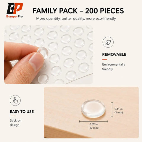 Hand holding clear cabinet door bumpers, three eighths inch self adhesive rubber cushions, bulk pack of 100 for furniture.