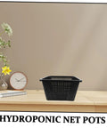 Hydroponic Net Pots And Mesh Grow Bags For Indoor Aquatic Plants, black plastic mesh grow pot on wooden table
