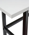 Close-up of Top Shelf Standing Bar Table With Twelve Built In AC Outlets And Sturdy Footrest, showing gray plastic top and black frame.