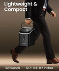 Man carrying Nugget Ice Maker Countertop Portable Sonic Pebble Ice Maker With Self Cleaning, compact size, black