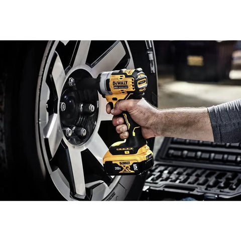 Hand using 20V Max Cordless Impact Wrench With 3/8 Inch Drive, Hog Ring Anvil, Tool Only, on car wheel lug nuts with LED ring