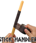 Ultra Smooth Anti Slip Drumstick Grip Tape Three Pack Black Cotton Gauze Roll being applied to a wooden drumstick.