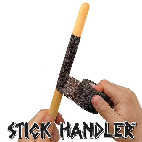 Ultra Smooth Anti Slip Drumstick Grip Tape Three Pack Black Cotton Gauze Roll being applied to a wooden drumstick.