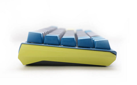 Kickass Sixty Percent Compact Mechanical Keyboard With Hot Swappable Top Tier Keys And Double Shot PBT Keycaps viewed from the side showing blue keycaps and sleek design.