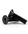 Close-up of M4 0.7 X 10mm flat head hex socket cap screws, black oxide finish, alloy steel, shown at an angle.