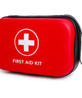 Front view: red compact hard-shell first aid kit with white cross emblem and FIRST AID KIT label, black strap.