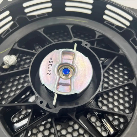 Close-up of Genuine Recoil Starter 28400-Z5T-306ZB Replacement unit for Honda EB4000X in OEM quality, showcasing metal core and black casing.