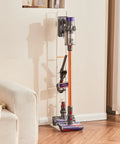 Dyson Vacuum Stand Organizer For V15 V12 V11 V10 V8 V7 V6 Cordless Models with vacuum, white metal bracket in living room.