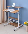 Height Adjustable Overbed Table With Smooth Rolling Casters, Sit To Stand Laptop Desk, Ergonomic Steel Frame Cart For Bed Or Couch, brown tabletop with two adjustable shelves.